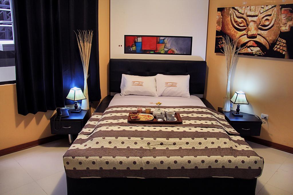 Villa Real Hotel & Suites Чиклайо Стая снимка
